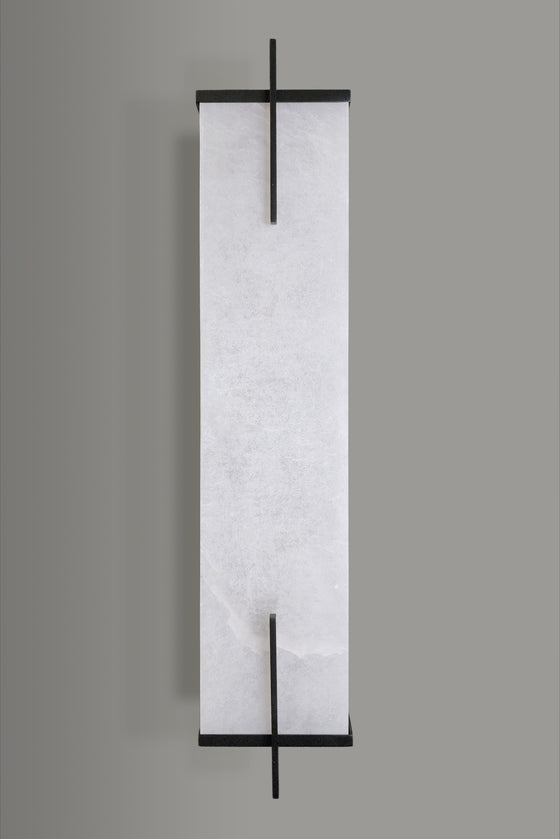 Decorative sconce with black frame and white marble-like pattern LED on a gray background