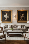 Living room with gray sofa, wooden coffee table, and framed ballet dancer portraits on the wall. Polished Stainless Steel glass sconce.