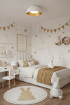 Children's bedroom with bunny-themed decor, including a bed, desk, and decorative items. white and gold ceiling light.