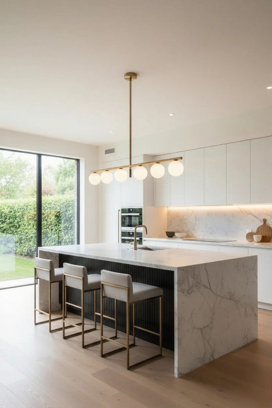 Modern kitchen with marble island and LED Satin brass pendant light