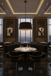 Luxurious dining room with round tables, chairs, and a large window view. pendant chandelier with black and gold fabric shade, black frame, glass ball accents
