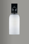 Wall-mounted light fixture with black fixture and white glass shade on a gray background