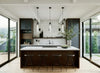 Modern kitchen with wooden cabinets, white countertops, and large windows. Matte black, frosted glass pendant