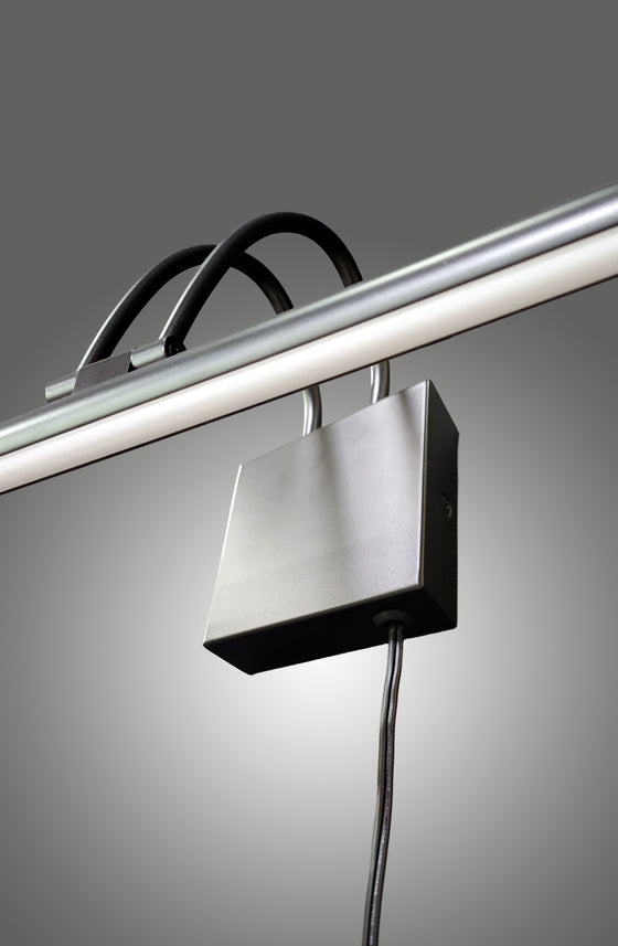 Modern matte black LED plug-in light fixture with a rectangular shade on a gray background