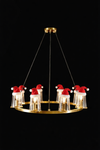 Satin Brass and clear glass Chandelier with Santa Claus figures wearing red hats on a black background