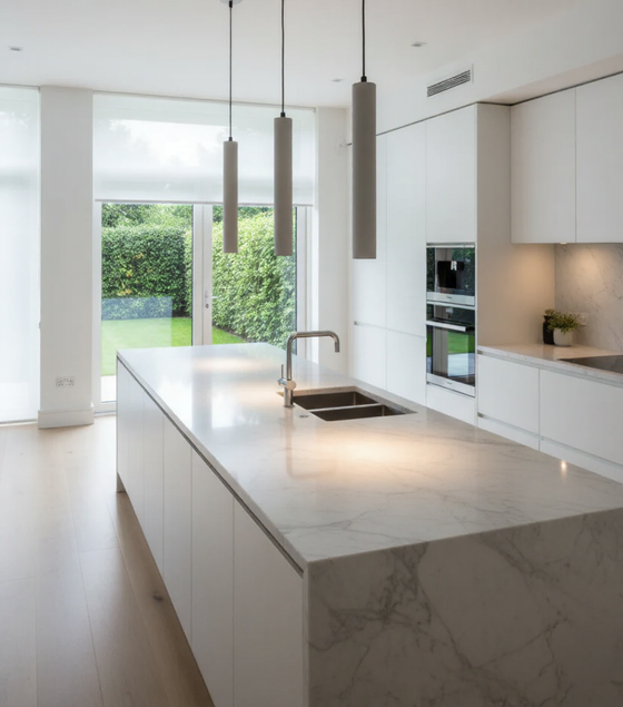 Pendants constructed of concrete Modern kitchen with marble island and white cabinets