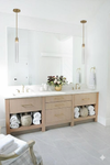 Satin Brass Pendants Bathroom with a large vanity, mirror, and decorative elements.