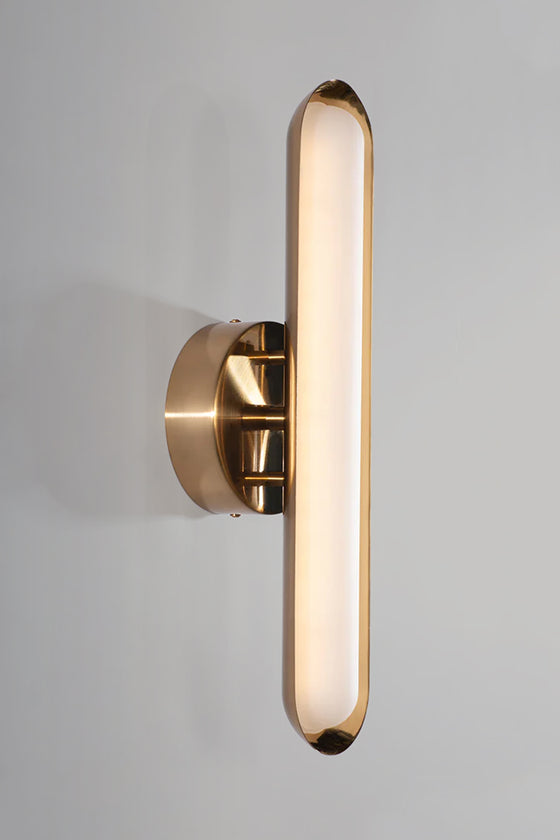 Gold wall-mounted light fixture on a gray background