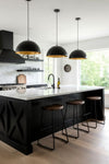 Modern kitchen Pendant with black island, pendant lights, and bar stools.