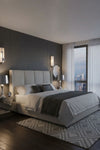 Modern bedroom with a large bed, nightstands, and a cityscape view. Alabaster Wall Sconce.