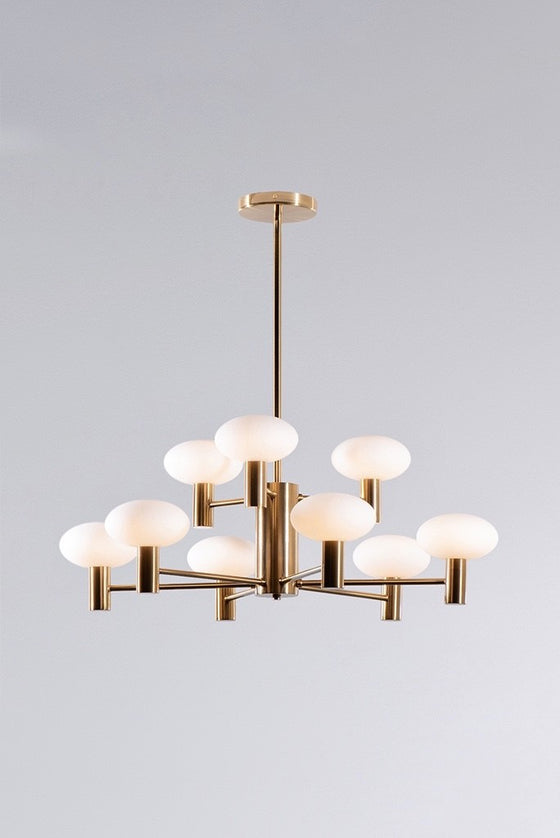 A Bank Glass Globe Chandelier with satin brass finish and matte white glass shades, featuring a vintage design.