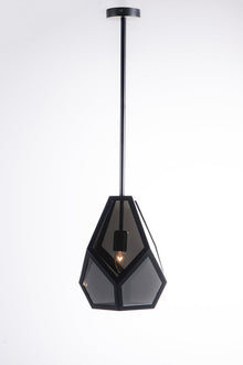  A geometric black pendant light with a tapered shape and a slightly mirrored tinted smoke glass shade.