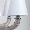 Detail view of white shades on the Fairmont Chrome Chandelier from The Vault