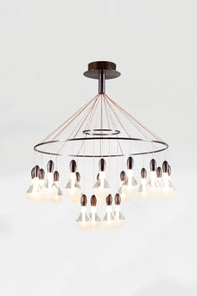 A satin bronze LED contemporary chandelier with clear glass shades and bronze-colored metal pendants.