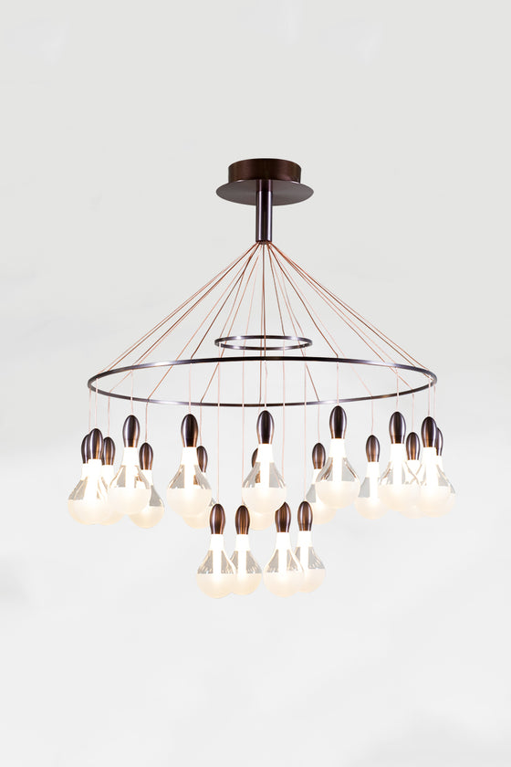 A satin bronze LED contemporary chandelier with clear glass shades and bronze-colored metal pendants.