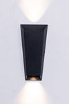 A modern black wall sconce with tapered body, casting light both up and down.