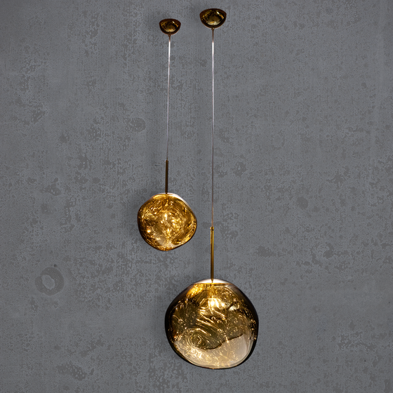 Two bubble-shaped pendant light fixtures with a metallic plated gold mirror shade, suspended by cords from a matching metallic canopy, displayed against a dark background.