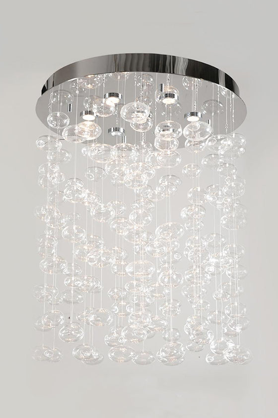 A contemporary silver flush LED ceiling mount chandelier with clear glass bubble decorations.