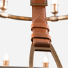 Close up view of leather strap detail of the Redford Leather Round Chandelier